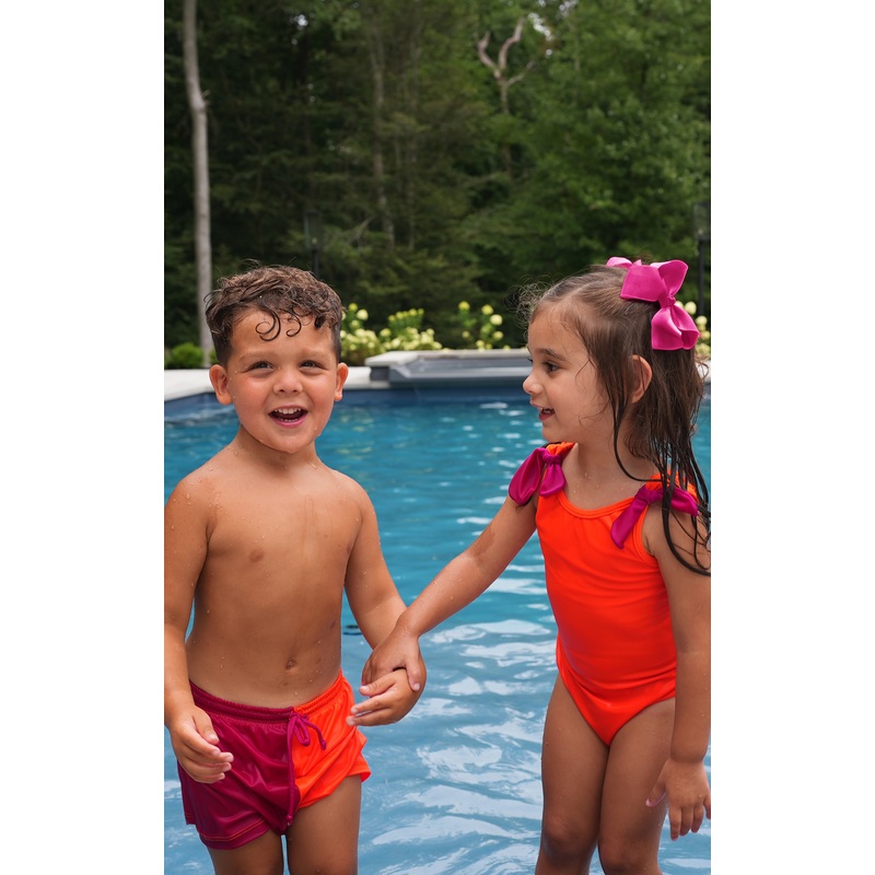 Minnie: Girl's Swimsuit in Neon Orange with Magenta Bows